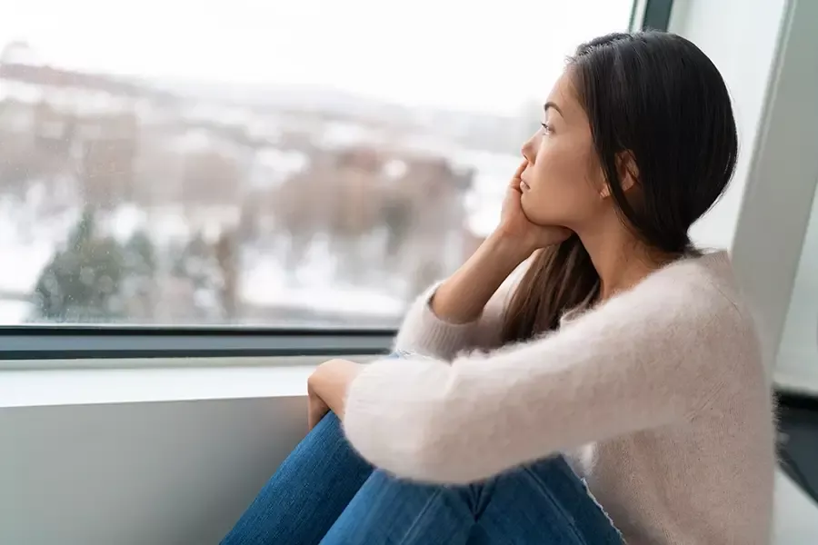 Lady looking out the window