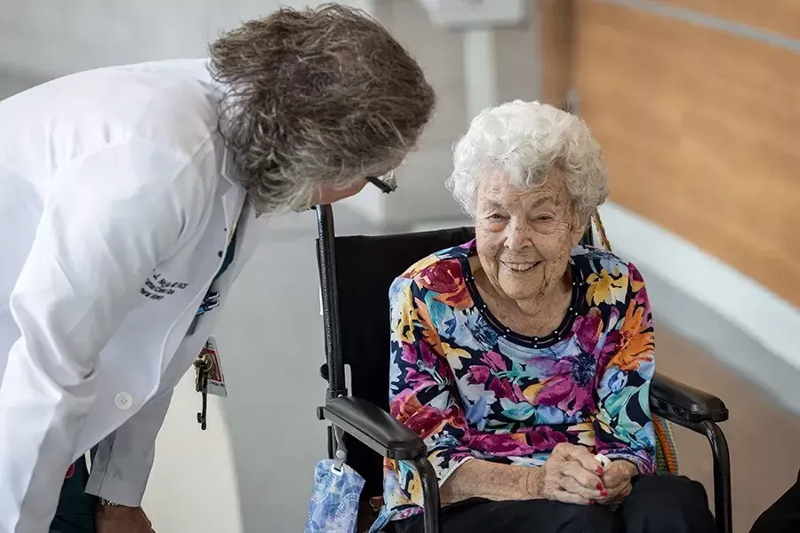 105 year old Sue Campbell smiles as she reunited with Dr. Rony Najjar