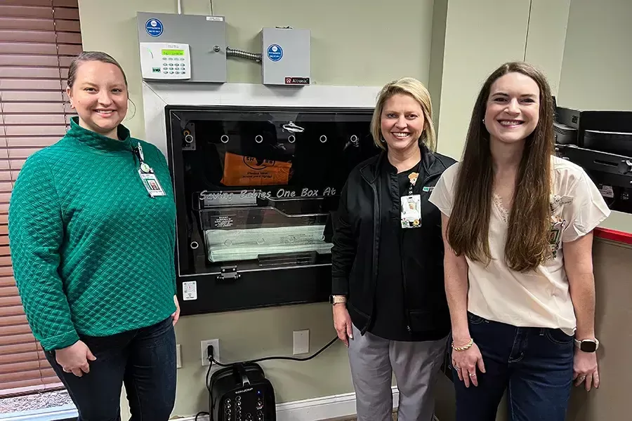 Members of the Madison Hospital nursery team take a photo with the Safe Haven Baby Box