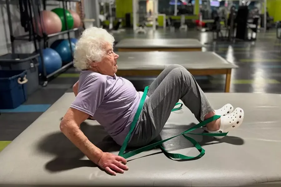 Regina Dembo stretches with resistance bands