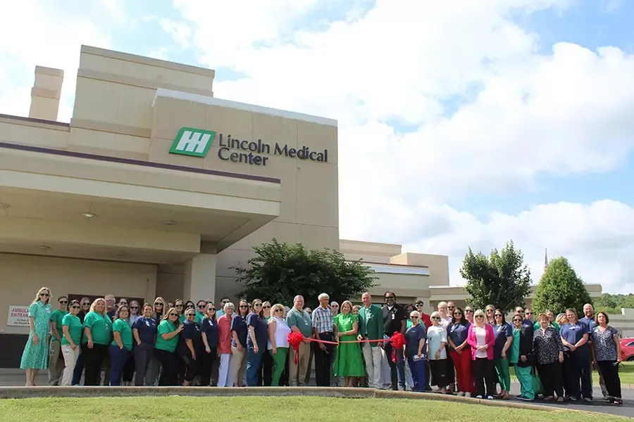 Rolling ribbon cutting at Lincoln Medical Center with employees