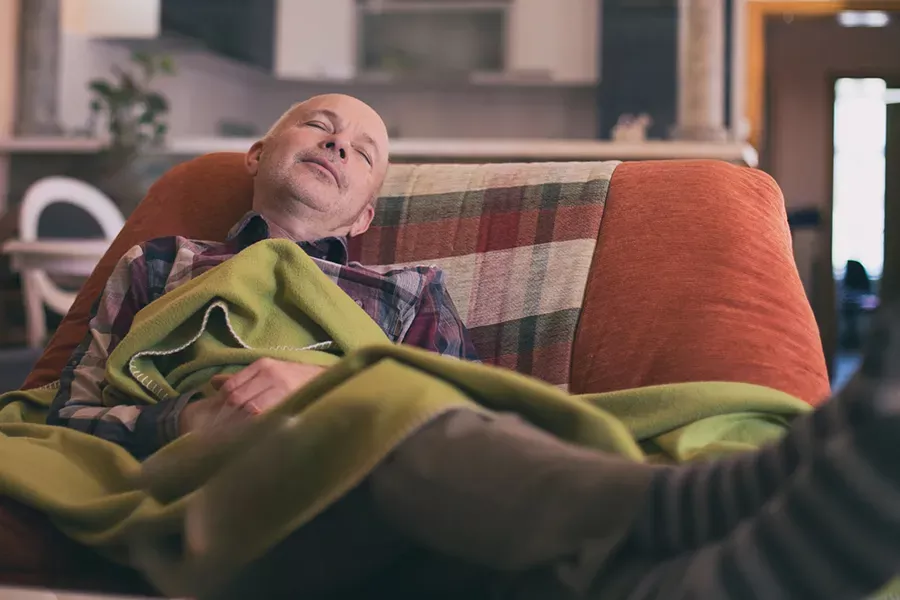 Man sleeping in chair