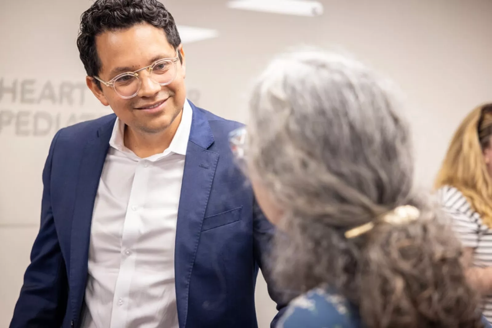 Dr. Caicedo greets guest